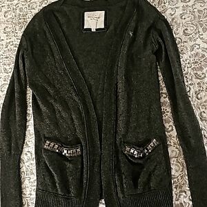 Dark gray cardigan with pockets.